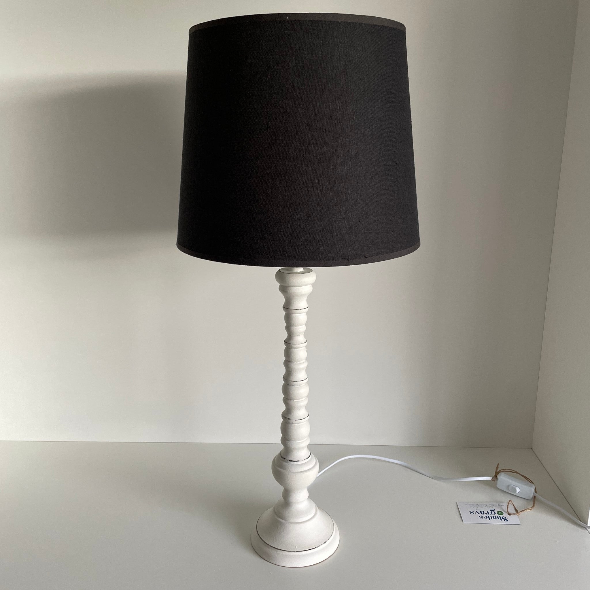 Large black tapered lampshade on white base, secondhand.