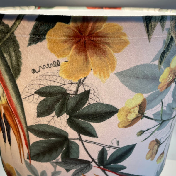 Large drum lampshade with velvet bouquet fabric, lit crease damage at the top, running from left to right.
