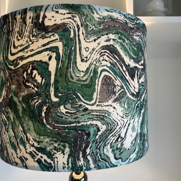 Large drum style lampshade with greywacke fabric, moss green, grey and white swirls.