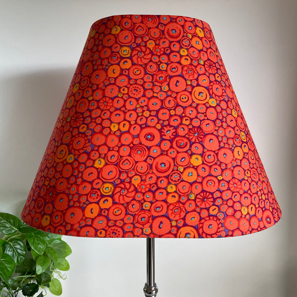 Large lamp shade handcrafted by shades at grays in nz with Kaffe Fassett button mosaic ornage fabric, unlit.