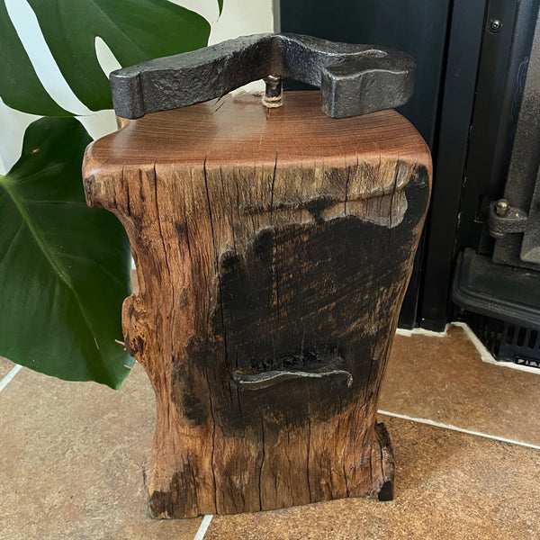 Large railway anchor on top of polished top of wharf timber door stop and front with original erosion, tar marks nail, crafted by shades at grays.