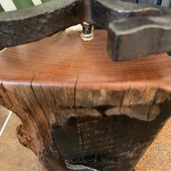 Large railway anchor on top of polished top of wharf timber door stop and front with original erosion lines and nail, close up, crafted by shades at grays.