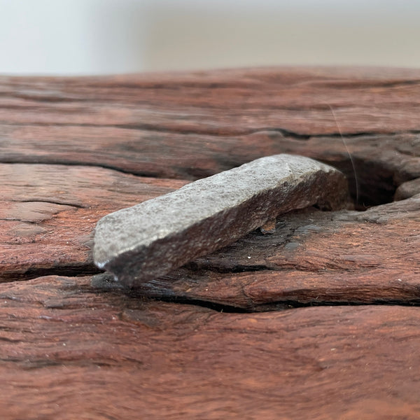 Large wood table lamp crafted by shades at grays from wharf timber, close up of retained original nail.