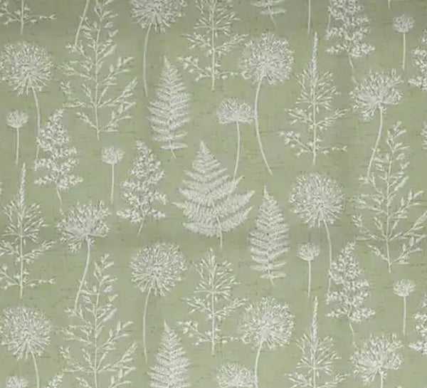 Close up of Meadow Green fabric: white silhouettes of ferns, seed heads and grasses on a soft sage green background.