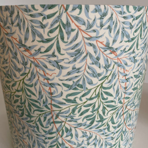 Medium cylinder lampshade in william morris willow boughs cream fabric, close up.
