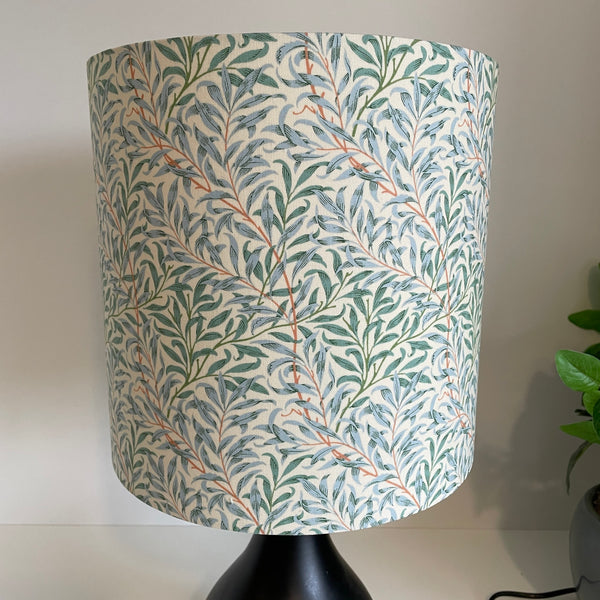 Medium cylinder lampshade in william morris willow boughs cream fabric, unlit by shades at grays.