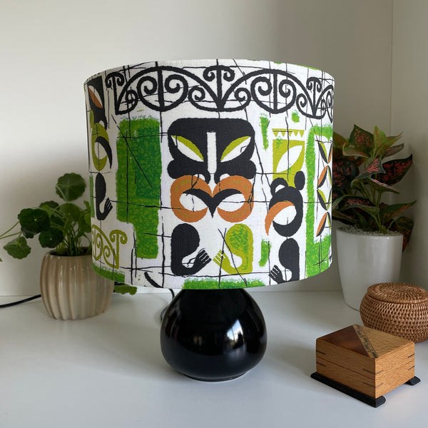 Medium drum lampshade in tiki vivid fabric by shades at grays, unlit.