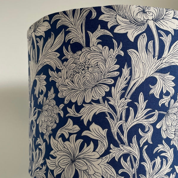 Fabric close up of lamsphade with Morris Chrysanthemum Tonal Blue fabric.