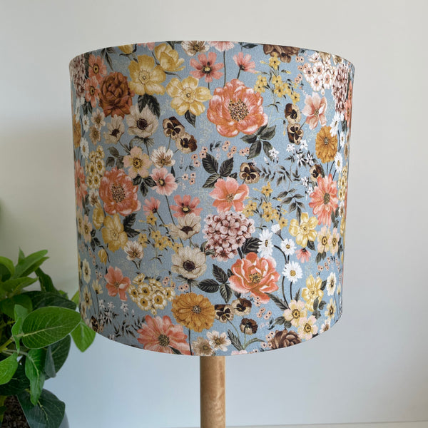 Medium drumshade floral mix fabric, unlit, close up, sold by shades at grays. 
