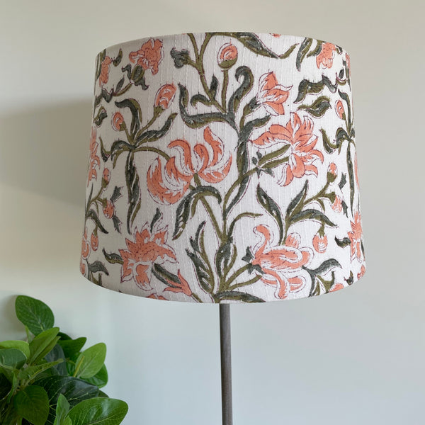 Medium tapered lampshade in blush bloom fabric, unlit, handcrafted by shades at grays.