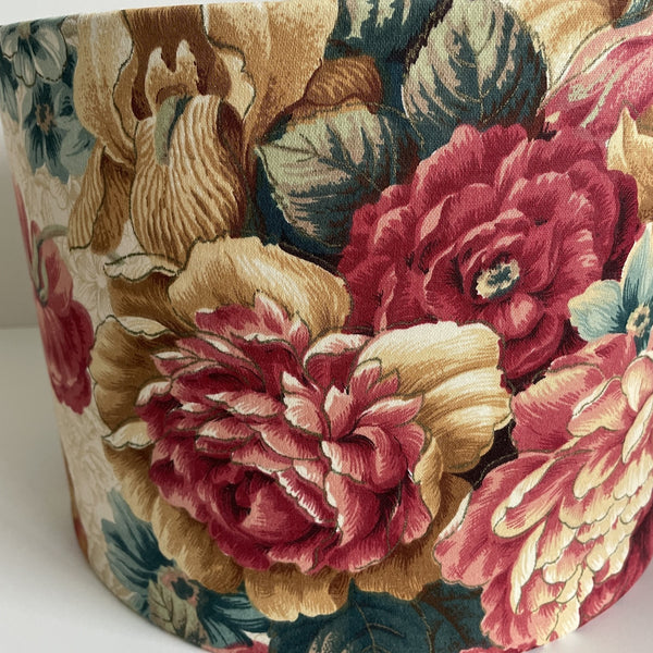 Medium drum ceiling lampshade in vintage floral fabric, handcrafted by shades at grays, close up.