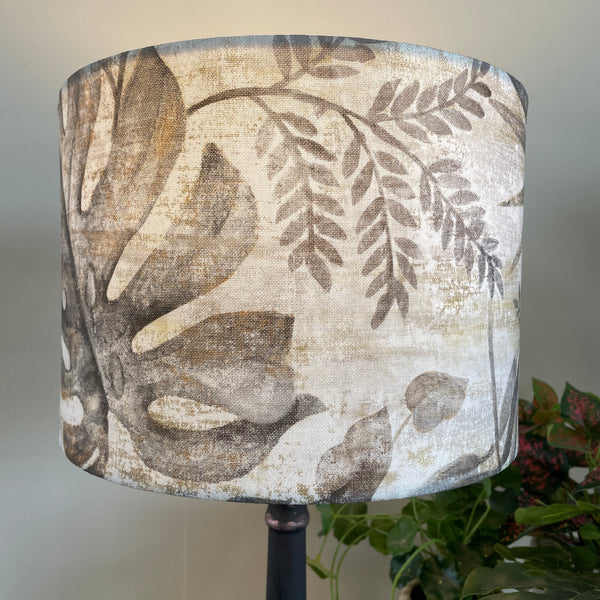 Medium drum fabric lamp shade, lit.