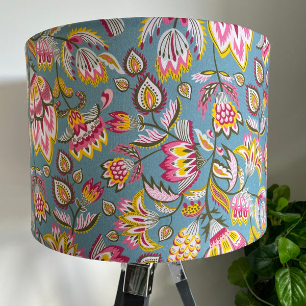 close up of medium drum hand crafted fabric lamp shade unlit.