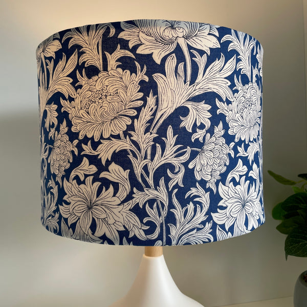 Medium drum lampshade with Morris Chrysanthemum Tonal Blue fabric, lit, shades at grays nz.