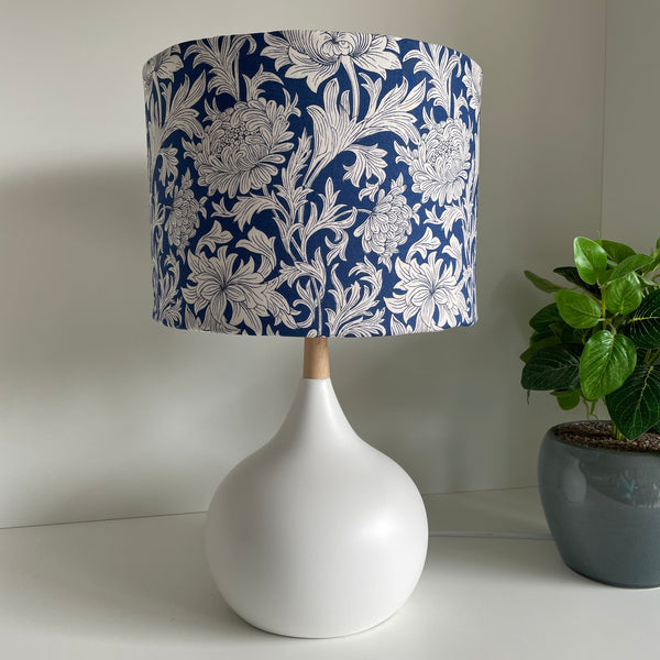Medium drum lampshade with Morris Chrysanthemum Tonal Blue fabric on white base, unlit, shades at grays nz.