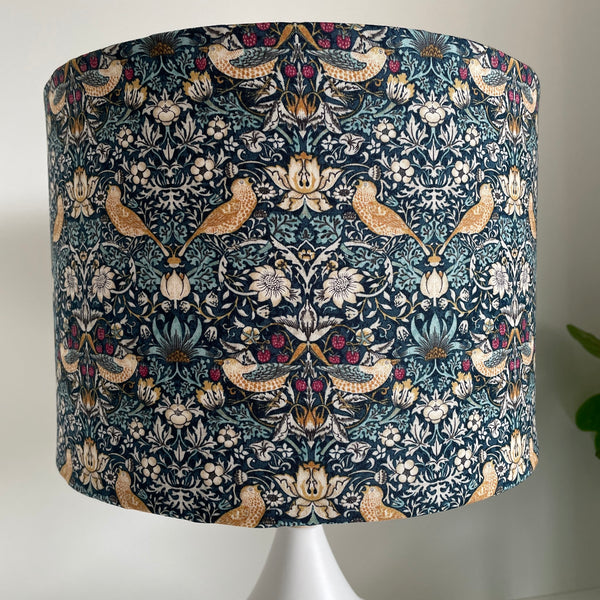 Medium drum lightshade with strawberry thief mini teal fabric, unlit by shades at grays nz.