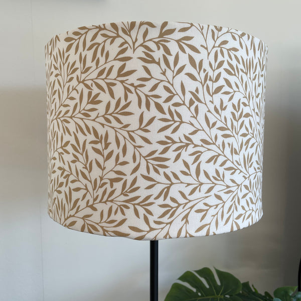 Medium drum style light shade with William Morris Lily Vellum Wandle fabric with brown leaves on cream background, unlit by shades at grays nz.