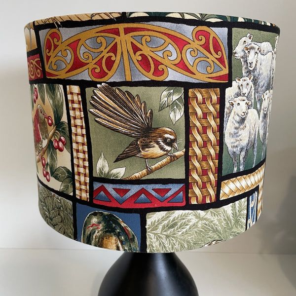Medium drum with kiwiana nature fabric, fantail, piwakwaka at front.
