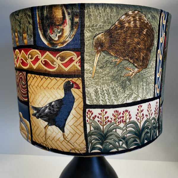 Medium drum with kiwiana nature fabric, kiwi and pukekoe at front, lit.