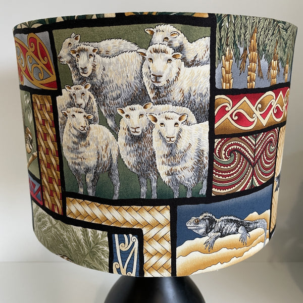 Medium drum with kiwiana nature fabric, by shades at grays, sheep at front, unlit.