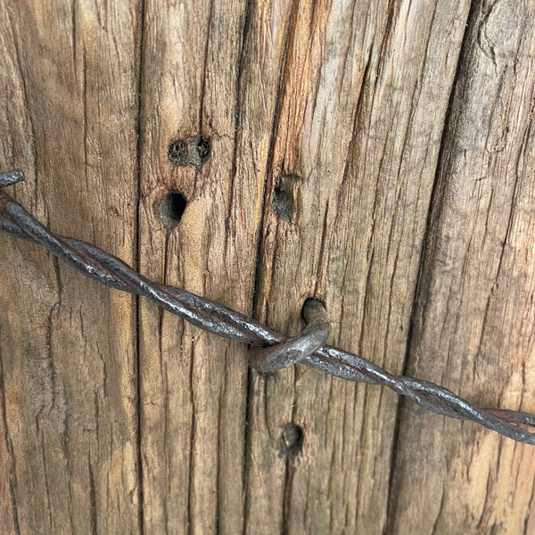 Original holes and fence post with wire on handcrafted wooden table lamp by shades at grays