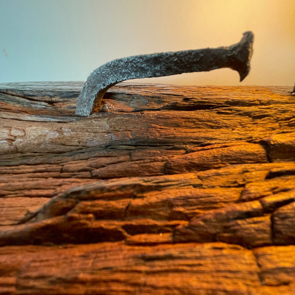 Original wharf timber table lamp handcrafted by shades at grays with original nail, close up.