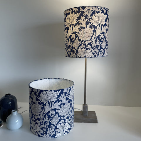 Pair of handcrafted William Morris blue chrysantemum fabric lampshades, 25 cm x 25cm cylinder, by shades at grays.