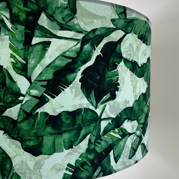 Pepperminty green background with large banana leaves fabric, handcrafted light shade made by Shades at Grays in New Zealand.