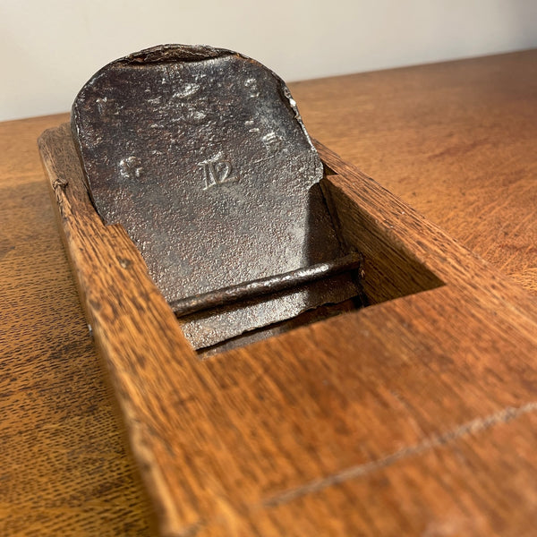 Rare table lamp upcycled from Japanese carpenter's plane close up of cutting blade.