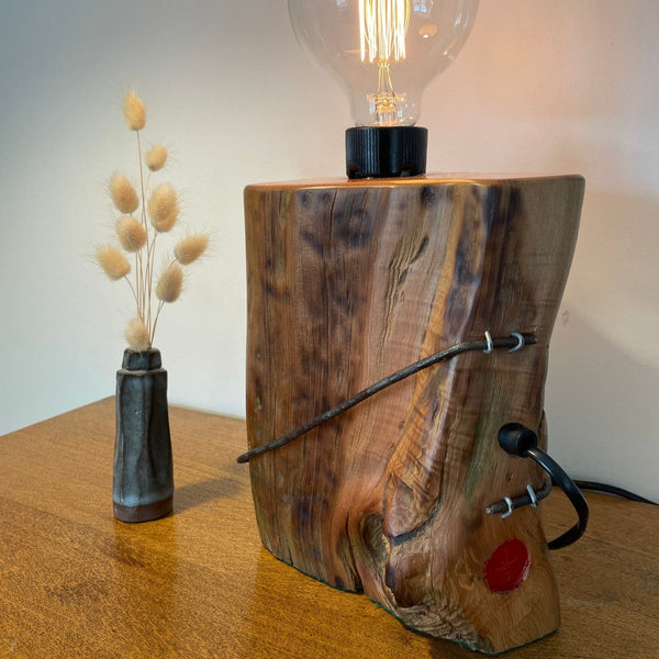 Polished smooth side with tabby markings and authentic wire from old tōtara post, back view with black lead and makers branding.