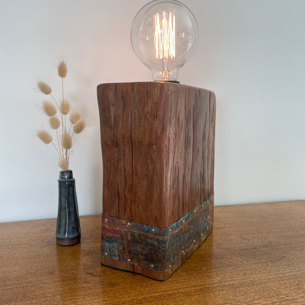 Reclaimed Wharf Timber & Copper Table Lamp, diagonal view with lit edison bulb.