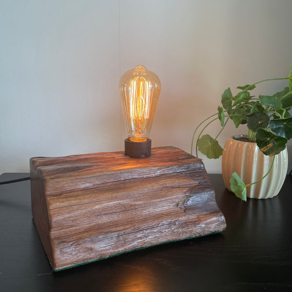 Reclaimed wharf timber table lamp, handcrafted by shades at grays with replica edison bulb, front view.