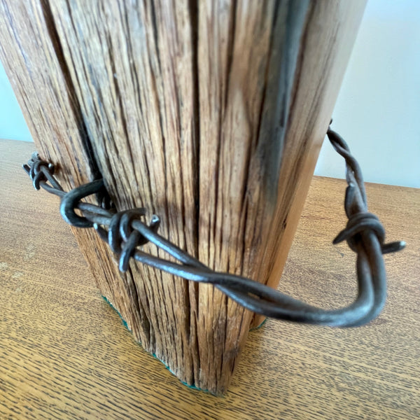 Reclaimed wood table lamp handcrafted by shades at grays from authentic totara fence post, close up of original wire.