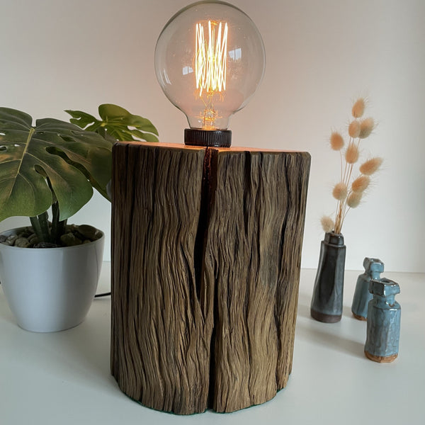 Round wooden table lamp upcycled from rustic telegraph post with edison bulb, lit crafted by shades at grays.