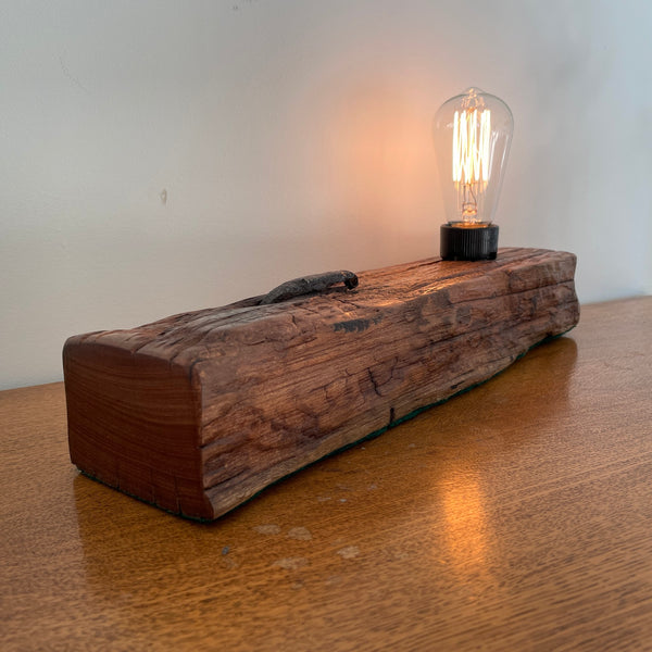 Wharf timber table lamp with edison bulb handcrafted by shades at grays, lit, end and side view.