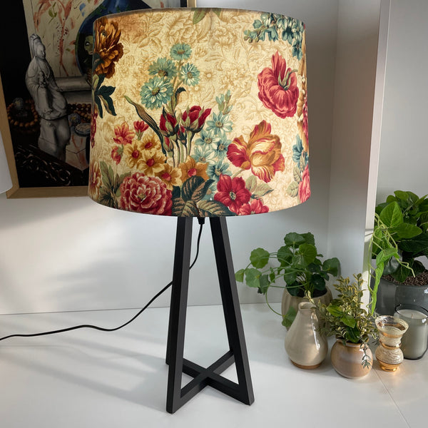 Shade at grays large tapered handcrafted fabric lamp shade on black stand.