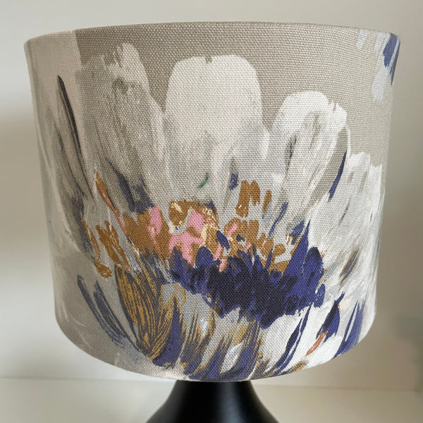 Small drum lampshade with two tone roses blue fabric, unlit, large white bloom.
