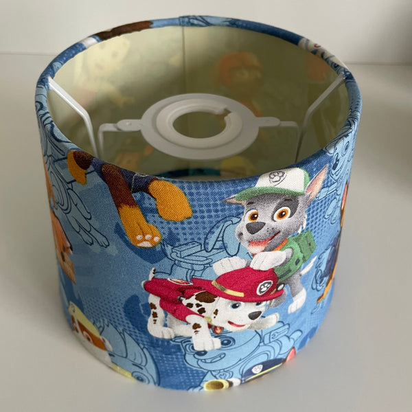 Fabric lampshade with cartoon characters on a white background