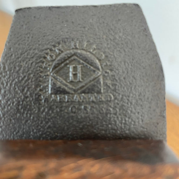 Small table lamp crafted by shades at grays from a vintage carpenter's plane, close up of cutting block with manufacturer's brand visible.