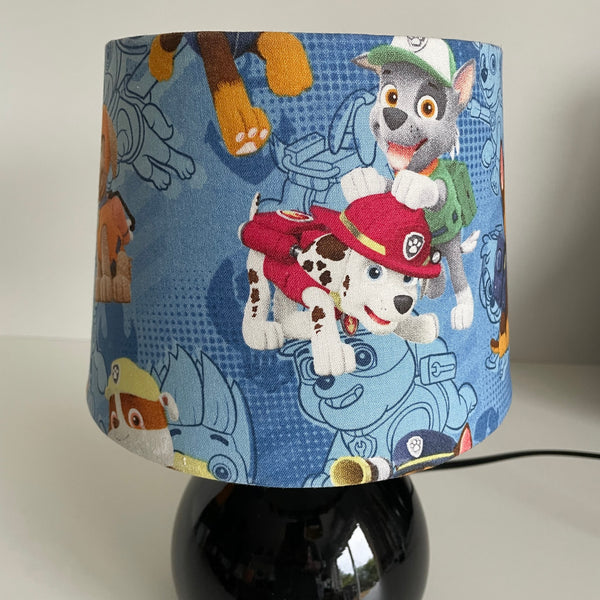 Lampshade with cartoon dog characters on a blue background