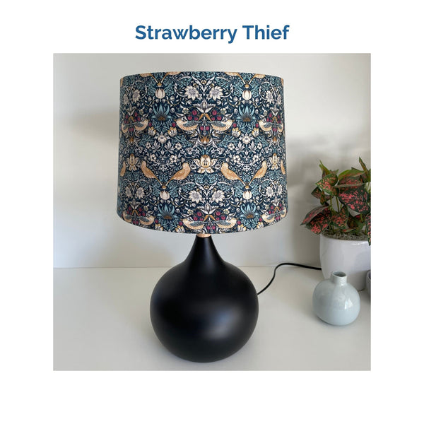 Strawberry thief fabric on medium drum lampshade and black touch base, unlit, crafted by shades at grays