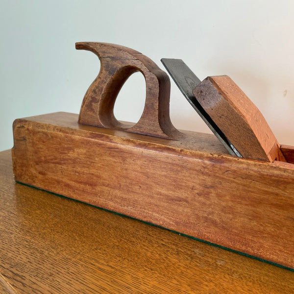 Table lamp crafted from large vintage carpenter's plane close up of full tote handle.
