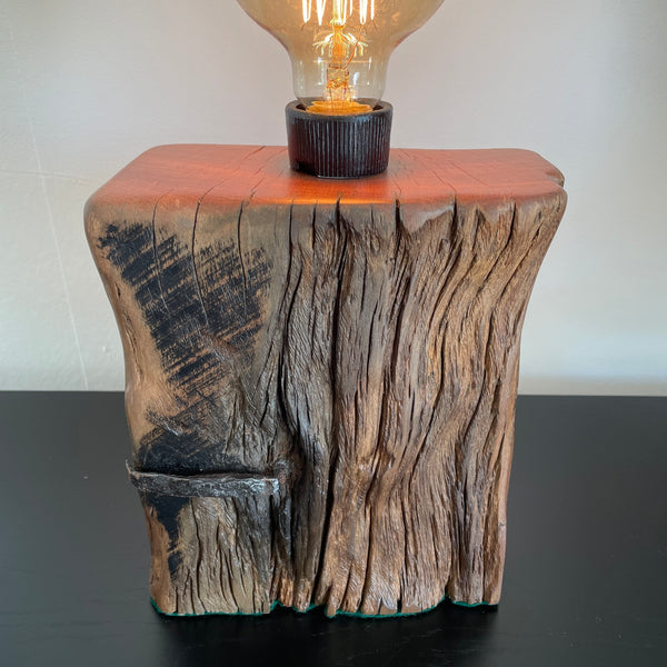 Table lamp crafted from original wharf timber by shades at grays nz, close up of wood grain front view.