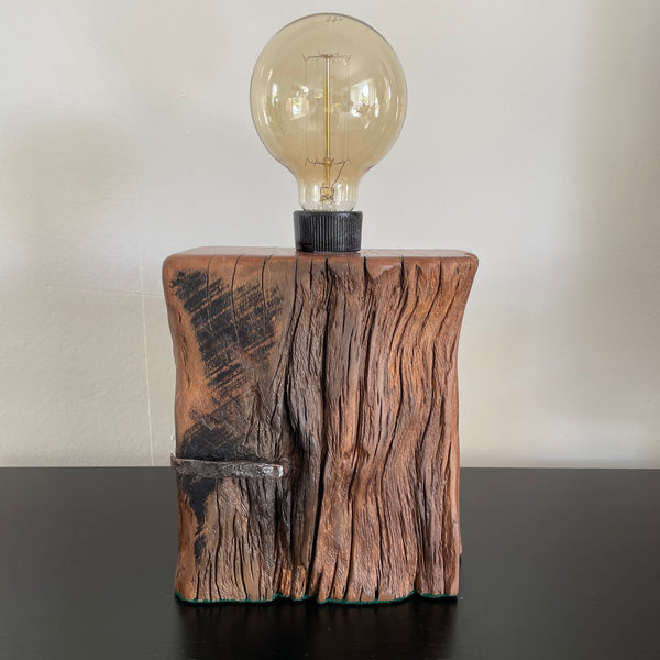 Table lamp crafted from original wharf timber by shades at grays nz, with original nail, unlit.