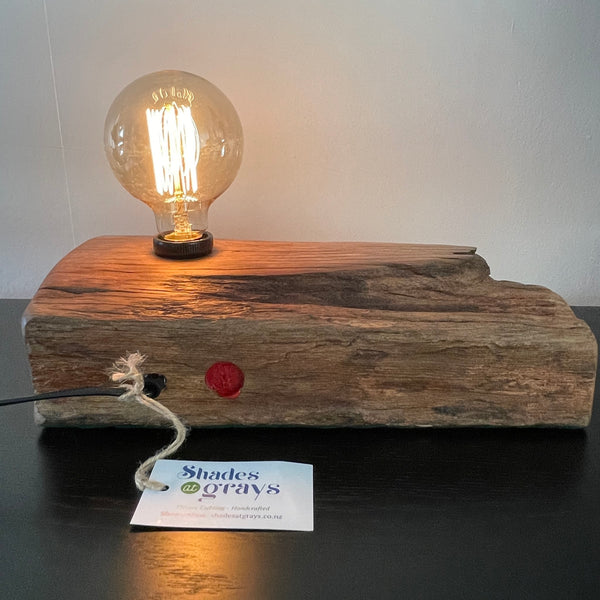 Table lamp crafted from reclaimed wharf timber, with replica edison bulb by shades at grays, nz, back view.
