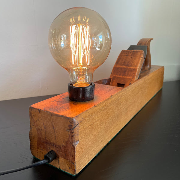 Table lamp made from authentic wood plane by shades at grays, nz, black lead, back view.