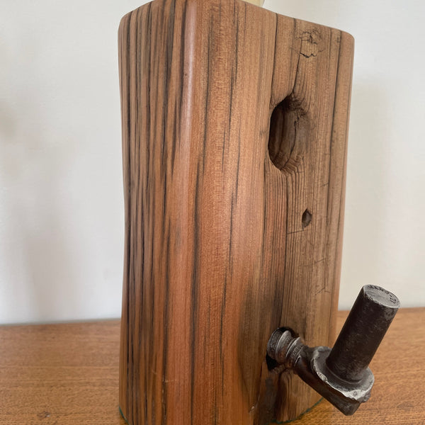 Tōtara Fence Post Lamp with Hinge and replica edison bulb, close up of hinge front grain, and hole, handcrafted by shades at grays.