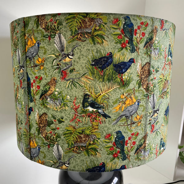 Two seams on kiwiana bird fabric large lampshade, lit.