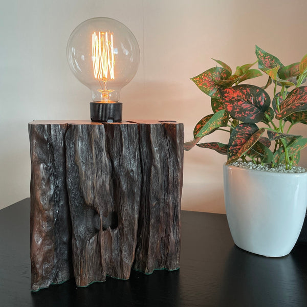 Wood table lamp from reclaimed railway sleeper, with natural erosion and replica edison lamp crafted by shades at grays, front view with deep grooves.