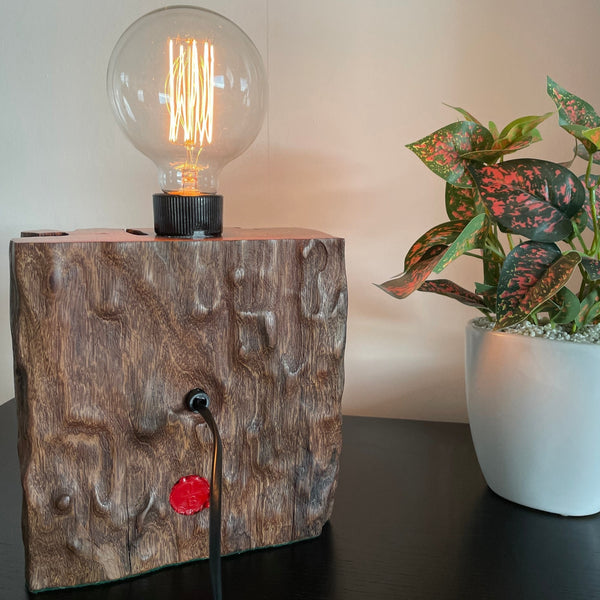 Wood table lamp from reclaimed railway sleeper, with natural erosion and replica edison lamp crafted by shades at grays, back view with black lead.